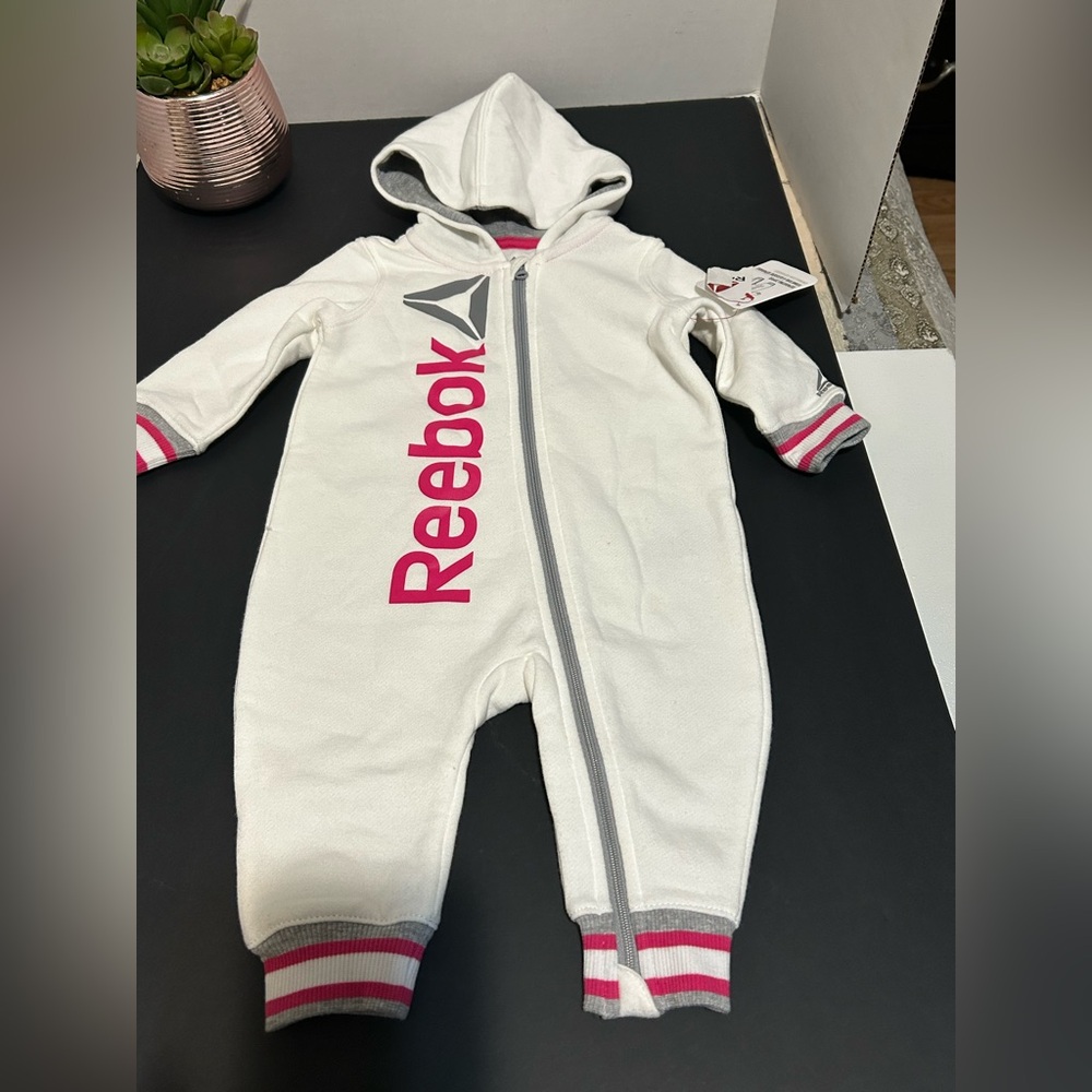 Reebok Kids One Piece in White with Pink Highlights